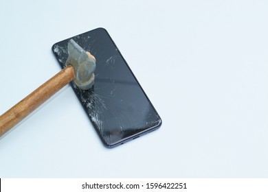 
Mobile Phone Smash With A Hammer, Concept Of Shelf And Fragility Of The Display