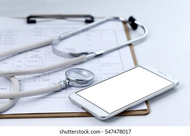 Mobile phone, stethoscope and chart file on the desktop (mobile medical, handheld doctor concepts) - Powered by Shutterstock