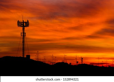 Mobile Phone Telecommunication Radio Antenna Tower. Cell Phone Tower With Sunset Sky, Silhouette 