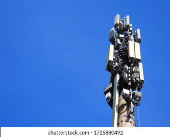 Mobile Phone Tower, Cell Tower, Tall - Right side of Image - Clear Blue Sky 