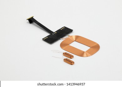 Mobile Phone Wireless charging module.  Copper coil part of Wireless charging circuit isolated on white background.