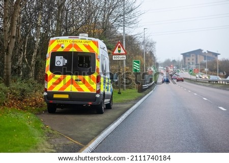 Mobile radar speed safety camera unit parked at the side of a city road checking traffic speed in the UK ストックフォト © 