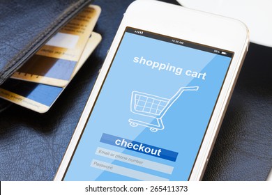 Mobile Shopping Concept  -  Virtual Shop On Phone Screen With Credit Cards 