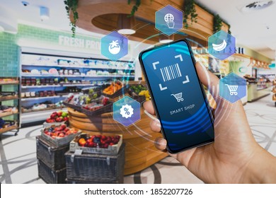 Mobile smart shop device in the checkout counter scan and go. Smart scan that allows customers to scan items from the shelves, pack them in their bag and then leave. - Shutterstock ID 1852207726