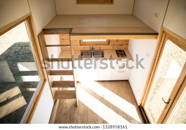 Mobile tiny house interior. Great for outdoor\
experiences and wildlife. Lots of space and pure adventure. No need\
for special authorizations, only a decent car to pull this tiny\
house and off you go.