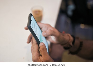 mobile using while tea drinking