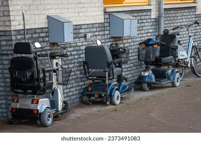 Mobility scooters parked in the street, mobility aid vehicles isolated