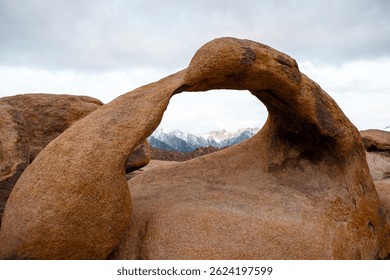 Mobius Arch frames Mount Whitney, the tallest peak in the contiguous United States, as seen from the Mobius Arch Loop Trail in the Alabama Hills near Death Valley, captured May 27, 2019