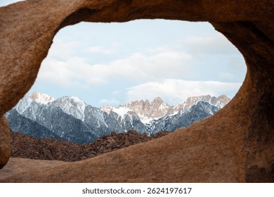 Mobius Arch frames Mount Whitney, the tallest peak in the contiguous United States, as seen from the Mobius Arch Loop Trail in the Alabama Hills near Death Valley, captured May 27, 2019