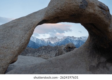 Mobius Arch frames Mount Whitney, the tallest peak in the contiguous United States, as seen from the Mobius Arch Loop Trail in the Alabama Hills near Death Valley, captured May 27, 2019