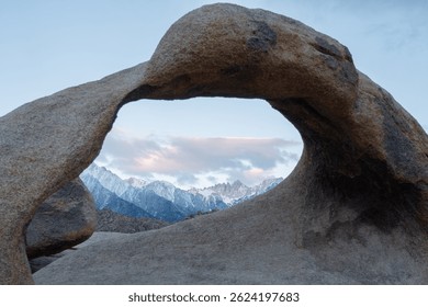 Mobius Arch frames Mount Whitney, the tallest peak in the contiguous United States, as seen from the Mobius Arch Loop Trail in the Alabama Hills near Death Valley, captured May 27, 2019