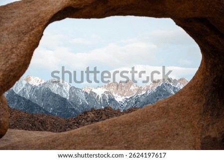 Mobius Arch frames Mount Whitney, the tallest peak in the contiguous United States, as seen from the Mobius Arch Loop Trail in the Alabama Hills near Death Valley, captured May 27, 2019