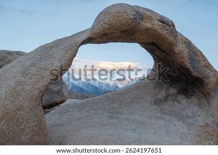 Mobius Arch frames Mount Whitney, the tallest peak in the contiguous United States, as seen from the Mobius Arch Loop Trail in the Alabama Hills near Death Valley, captured May 27, 2019