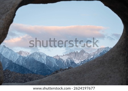Mobius Arch frames Mount Whitney, the tallest peak in the contiguous United States, as seen from the Mobius Arch Loop Trail in the Alabama Hills near Death Valley, captured May 27, 2019