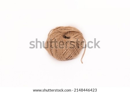 Mocap. A ball of brown threads on a white background