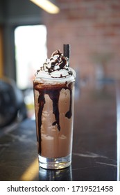 Moccha frappe topping with whiped cream and chocolate sauce.