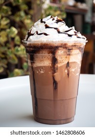 Mocha Frappe In Plastic Cup. Served With Whipping Cream And Chocolate Sauce. Freshness Drink. Favorite Caffeine Beverage.
