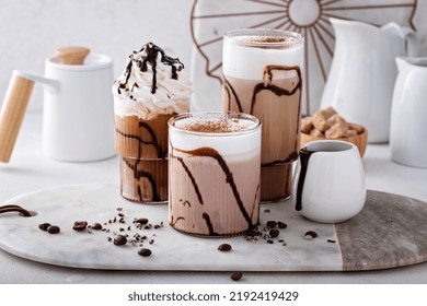 Mocha Latte And Iced Frappe Topped With Whipped Cream And Chocolate Syrup, Refreshing And Sweet Coffee Drinks