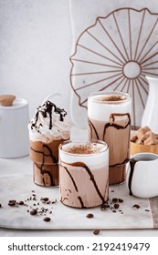 Mocha Latte And Iced Frappe Topped With Whipped Cream And Chocolate Syrup, Refreshing And Sweet Coffee Drinks