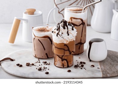 Mocha Latte And Iced Frappe Topped With Whipped Cream And Chocolate Syrup, Refreshing And Sweet Coffee Drinks