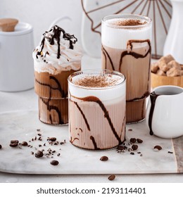 Mocha Latte And Iced Frappe Topped With Whipped Cream And Chocolate Syrup, Refreshing And Sweet Coffee Drinks