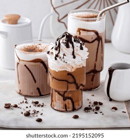 Mocha Latte And Iced Frappe Topped With Whipped Cream And Chocolate Syrup, Refreshing And Sweet Coffee Drinks