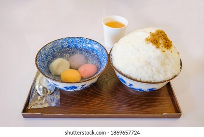 Mochi Bingsu. Bowl Of Milk Shaved Ice Topped With Ginger Powder  Served With Bowl Of Sticky Rice Ball (called Bua Loy) Filling With Black Sesame, Sweet Potato,taro And Custard.Thai Fusion Dessert.