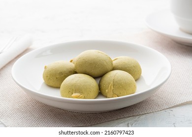 Mochi Cakes With Durian And Salted Egg Filling On White Plate