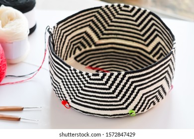 Mochila Wayuu Crochet Bag With Yarn Ball And Wood Crochet Needles On White Background. Tapestry Crochet Bag.