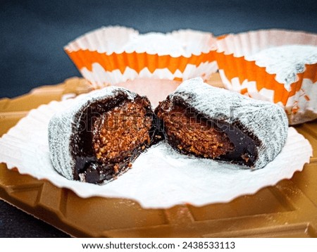 
a moci cake filled with chocolate nuts was served on the table Foto d'archivio © 