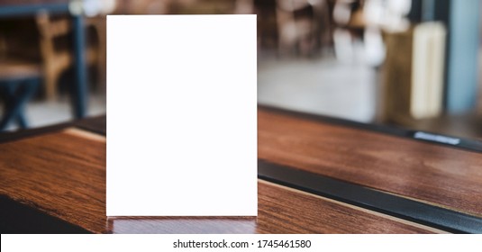 Mock up acrylic frame posters pattern template forms background, blank menu frame on table in coffee shop stand for your text of display your product. - Shutterstock ID 1745461580