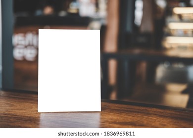 Mock up acrylic frame posters pattern template forms background, blank menu frame on table in coffee shop stand for your text of display your product.