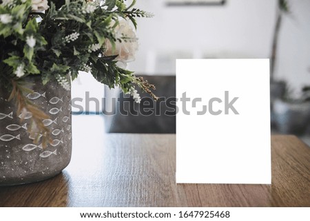 Mock up acrylic frame posters pattern template forms background, blank menu frame on table in coffee shop stand for your text of display your product.