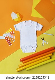 Mock Up - Baby Onesie With Orange Background