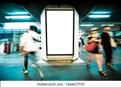 Mock Up Blank Billboard White LED Screen Vertical For Advertising On Sky Walk In Bangkok. Public Building People Walking Movement Motion Blur Style.