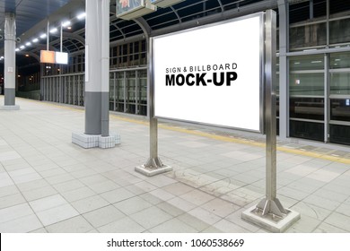 Mock Up Blank Horizontal Billboard On Stainless Steel Case At Train Station Platform With Clipping Path, Perfective With Empty Space On White Screen For Advertising, Information To Public 