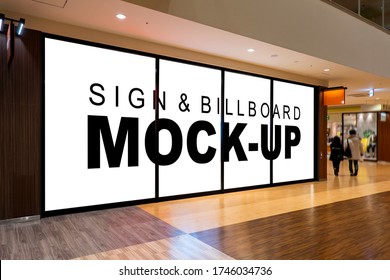 Mock Up Blank Large Billboard With Clipping Path On Glassy Showcase Window In Shopping Mall Interior. Empty Space For Insert Advertising Graphic Design 