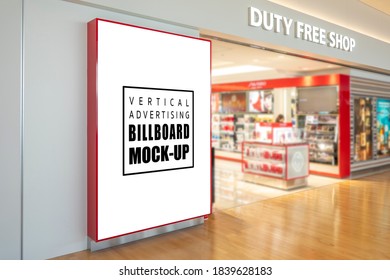 Mock Up Blank Large Billboard With Clipping Path On Black Metallic Wall Near Entrance To Duty Free Shop At Airport Terminal, Empty Space For Insert Advertising, Announcement, Promotion Or Information 