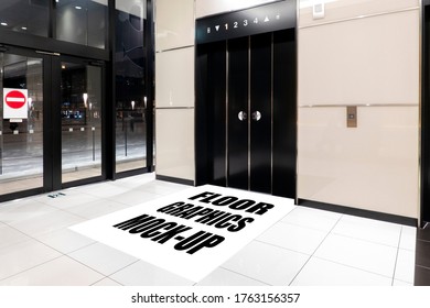 Mock up blank large graphic template on floor at front of elevator entrance at modern building, empty space for insert text for advertising, media design or caution, announcement information 