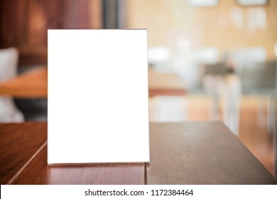 Mock up blank menu frame on table in coffee shop stand for your text of display your product. - Shutterstock ID 1172384464