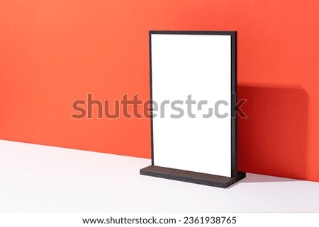 Mock up of blank menu frame, Stand for booklets with white sheets paper on red background with copy space
