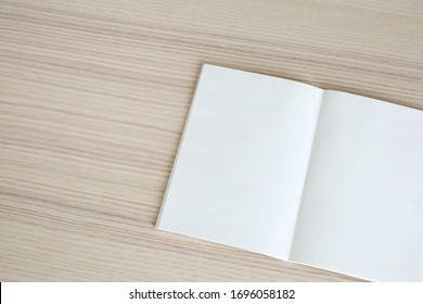 Mock Up Blank Open Paper Book On Wood Table Background