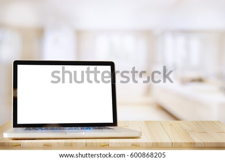 Mock up Blank screen laptop on wood top table and blurred bath room background. for Procuct display montage.