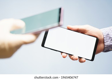 Mock up blank screen of two smartphone for online payment application or scanning OR code concept. Background, Studio, Advertising, Clipping path, Covid passport, Data transfer, Secured, Technology.