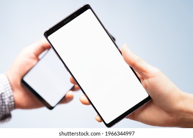 Mock up blank screen of two smartphone for online payment application or scanning OR code concept. Background, Studio, Advertising, Clipping path, Covid passport, Data transfer, Secured, Technology.