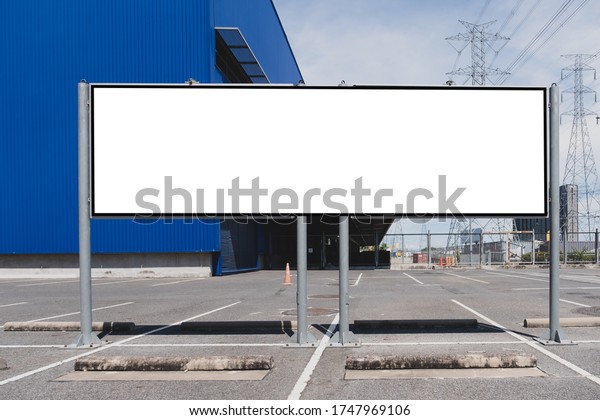 mock up of\
blank showcase billboard or advertising light box for your text\
message or media content with car in the parking lot in row,\
commercial, marketing and advertising\
concept.