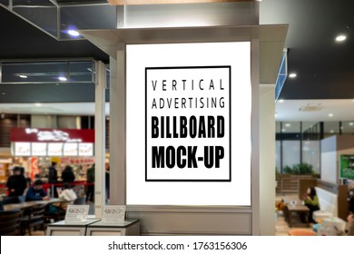 Mock Up Blank Vertical Signboard With Clipping Path On The Pole At Food Court In Shopping Mall, Empty Space For Insert Advertising Or Announcement Information 