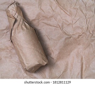 Mock up  bottle wrapped in a paper bag brown harmonious background - Powered by Shutterstock