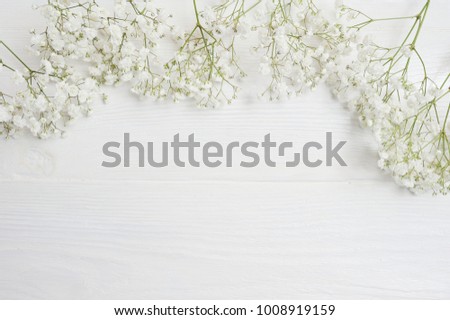 Mock up Composition of white flowers rustic style, for St. Valentine's Day with a place for your text. Flat lay, top view photo mock up