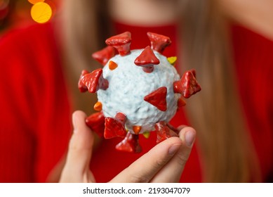 A Mock Up Of Coronavirus Cell In Girls Hand, Close Up. Concept Of Flu, Quarantine And Lockdown